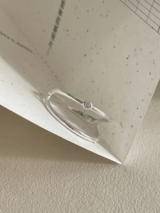 Close-up of double-layer S925 sterling silver ring with cubic zirconia inlay and S925 stamp