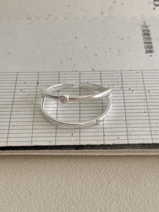 Close-up of double layer 925 silver ring with small white zircon and S925 hallmark