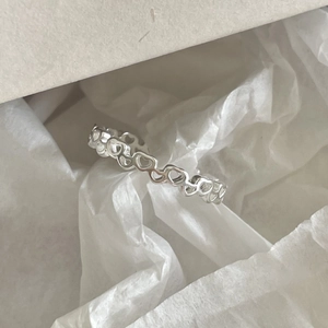 Elegant 925 sterling silver ring featuring an openwork heart design in a high-polish finish