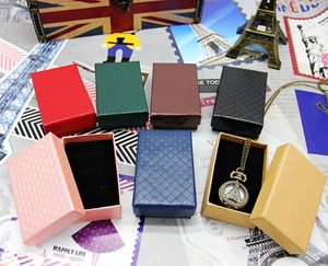 Close-up of textured diamond pattern jewelry gift boxes in multiple colors with foam inserts