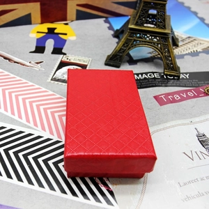 Macro shot of red jewelry gift box with diamond pattern texture for necklace or ring