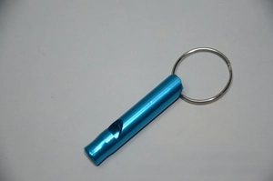 Close-up of a bright blue aluminum survival whistle with a silver keychain ring
