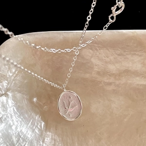 Elegant 925 sterling silver swallow bird coin necklace with matte textured finish