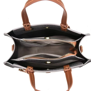 Interior detail of grey herringbone canvas tote bag showing multi-compartment design