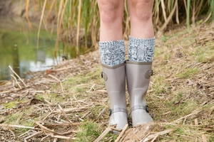 Close-up of grey rubber rain boots with thick knitted warm liner and side buckle detail