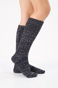 Detail of thick navy blue mixed knit wool socks with ribbed texture and warm long fit