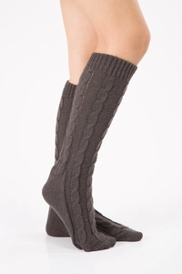 Detailed cable-knit texture on dark grey over-the-knee leg warmers with thick yarn