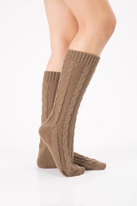 Detail of dark brown cable knit leg warmers showing texture and mid-length fit