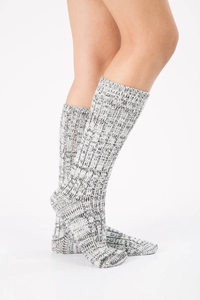 Close-up of thick knit floor socks showing black and white mixed texture and warm fabric