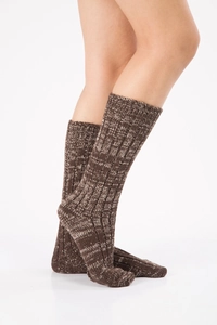 Detailed knit texture of warm brown mixed yarn winter socks in a mid-calf length