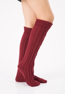 Detail view of wine red cable knit thigh high leg warmers with thick texture