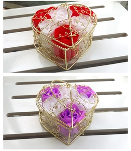 Detail of heart-shaped wire baskets with red, white and purple soap flower roses