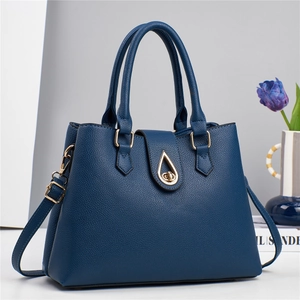 Elegante borsa a mano in pelle blu scuro con motivo litchi e chiusura a scatto dorata