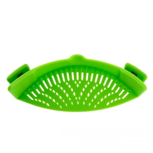 Macro shot of green silicone pot strainer with fine drainage holes and secure side clips