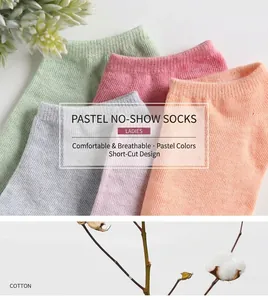 Close-up of lightweight cotton low-cut socks in pastel candy colors with soft texture