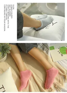 Detail of pink and grey cotton ankle socks with soft knit texture and elastic cuffs