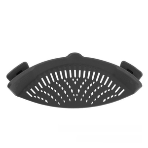 Close-up of a dark grey silicone pot strainer with clips and a multi-hole drainage design