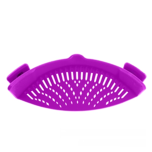 Close-up of a purple silicone pot strainer showing crescent drainage holes and snap-on clip