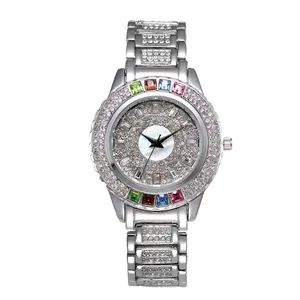 Silver metal watch with diamond pavé dial and rainbow gemstone bezel for women