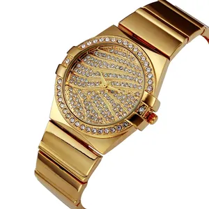 Luxury gold women's watch featuring a crystal-encrusted bezel and metallic link strap
