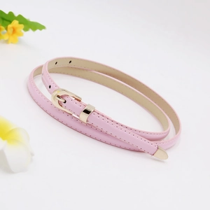 Detailed view of a slim pink leather belt for women with elegant golden metal buckle