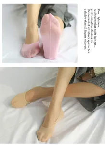 Macro shot of ultra-thin low-cut invisible velvet socks in pink and beige skin tones