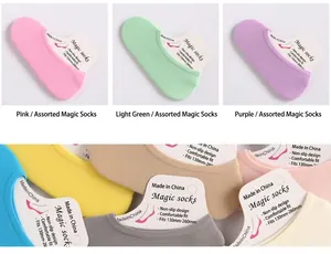 Close-up of colorful velvet invisible magic socks with silicone grip and cardboard packaging