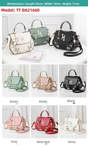 Detail showing embroidered floral patterns and H-logo on elegant faux leather handbags