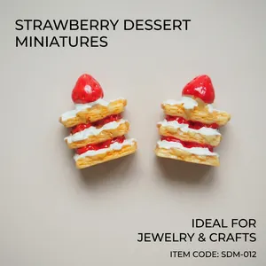 Detailed top view of miniature resin strawberry napoleon cake charms for DIY crafts