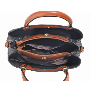 Top view of woven tote bag showing three internal compartments and golden metal zippers