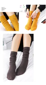 Close-up of mustard yellow and dark brown ribbed knit cotton slouch socks for women