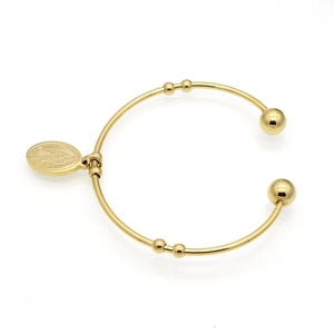 Detailed macro view of 18k gold plated cuff bracelet with Virgin Mary oval pendant