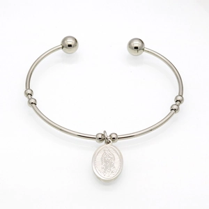 Religious silver open bangle with a Virgin Mary oval charm and polished round end caps