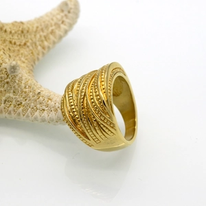 Gold plated stainless steel chunky layered wave ring displayed with a starfish prop