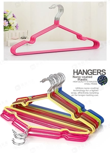 Close-up of non-slip dipping coating on colorful stainless steel adult clothes hangers