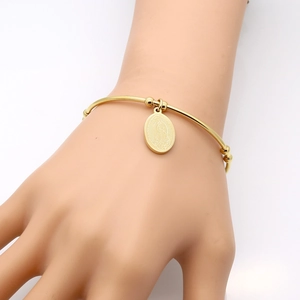 Detail of 18k gold plated titanium steel cuff bracelet with Virgin Mary oval pendant