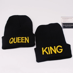 Detail of couple beanie set in black with yellow King and Queen 3D embroidery