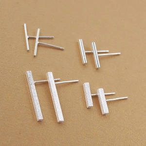 Detailed view of 925 silver cylinder bar studs in smooth and matte finish styles