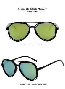 Detail view of geometric polygon sunglasses with glossy black frames and gold mercury lenses