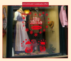 Detail of red festive Christmas window stickers with snowflake and lantern patterns