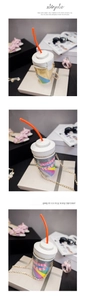 Close-up of Unicorn Tears glitter drink-shaped crossbody bag with rainbow accents