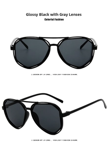 Detail view of stylish polygonal sunglasses with black double metal frames and grey lenses