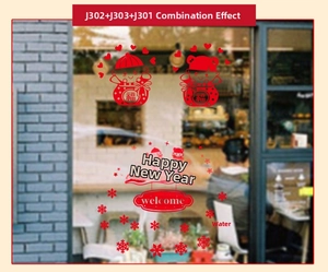 Detail view of festive New Year window decals with red God of Fortune and snowflake motifs