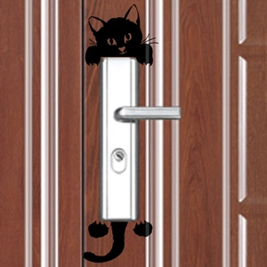 3D black cat silhouette wall sticker appearing behind a silver door handle