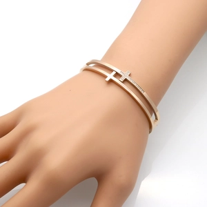 Rose gold double-layer cross bangle with sparkling crystals on minimalist cuff bracelet