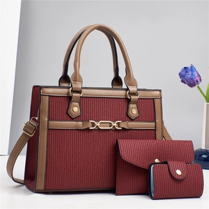 Three-piece set of wine red tote bags with vertical striped texture and gold hardware