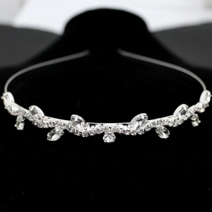 Detail of silver leaf vine headband with sparkling crystals on black velvet stand