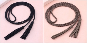 Detail of woven waist ropes in black and brown with elegant fringe for Hanfu dresses
