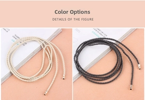 Detailed view of woven waist belts in beige and dark gray colors with metal tips