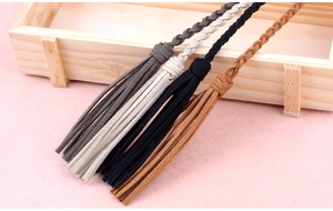 Close-up of suede tassel waist ropes in gray, beige, black, and brown for Hanfu dresses